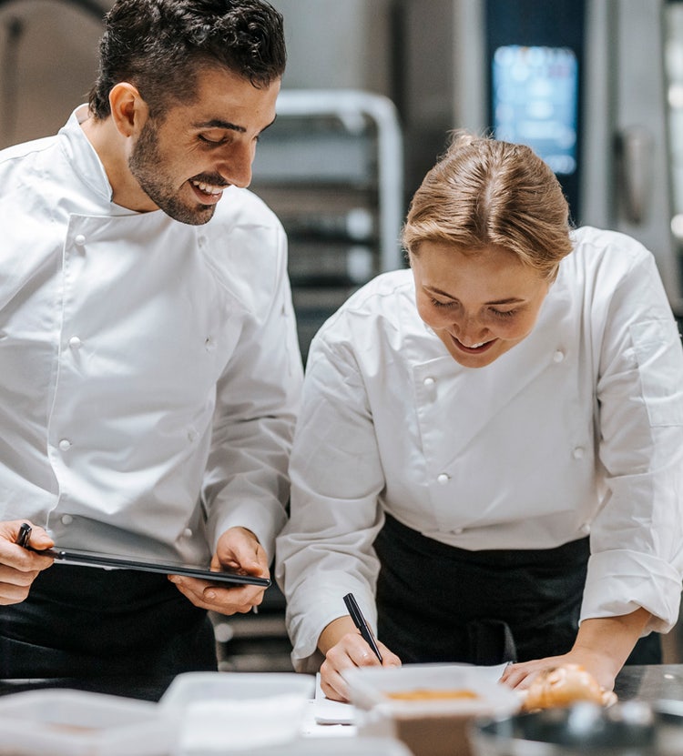 Chefs doing bookkeeping - Avendra International's culinary support